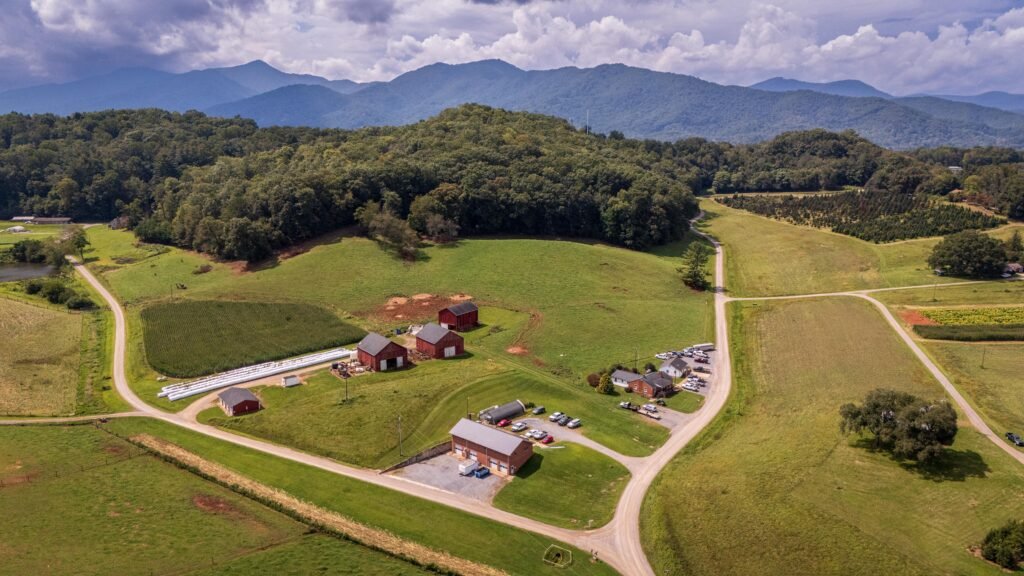 Rural farmland and mountain ridge terrain typical of the Brindlee Mountain area around Arab, Alabama